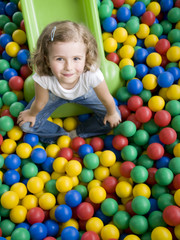 Fototapeta na wymiar Playing in colorful balls