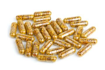 Pile of homeopathic pills with bee pollen