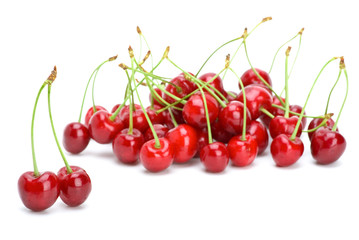 Obraz na płótnie Canvas Some ripe red cherries with stalks