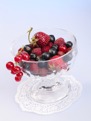 fresh tasty berries in the glass bowl