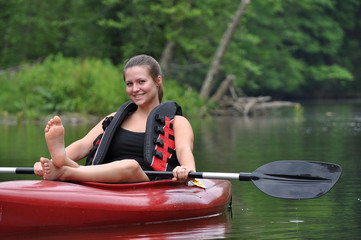 Woman relaxes on Kayak