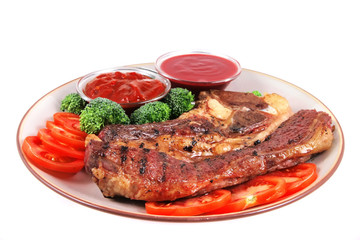 served beef steak and hot chili sauces