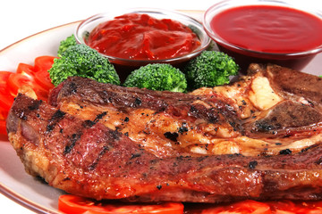 roast juicy fat steak and hot sauces