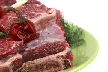 uncooked ribs on dish