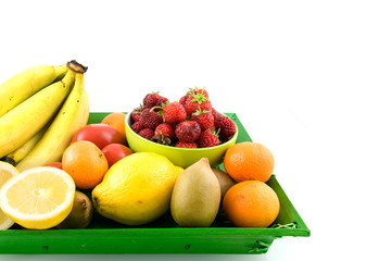 Summer fruit on green tray on white background