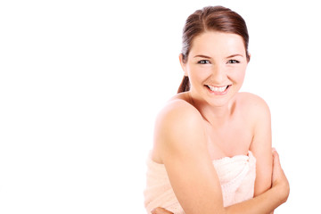 Smiling woman wearing bath towel