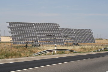 Placas solares al lado de la carretera. - obrazy, fototapety, plakaty