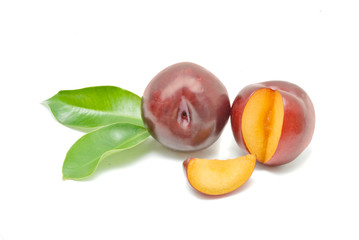 Plums and segment isolated on white background
