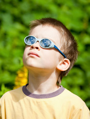 Kid wearing sunglasses