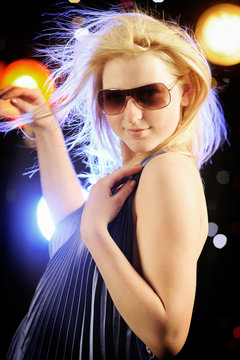 Beautiful blond woman dancing in the nightclub