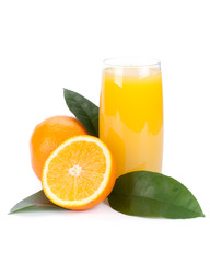 Fruits with green leaves and glass of juice