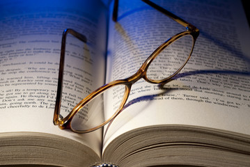 Book and reading glasses