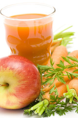 glass of fresh juice, some carrots and apples