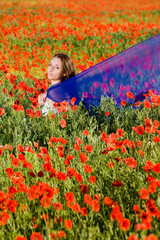 Sensual girl in the poppy field