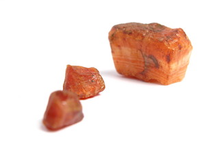 Group of red stones on white background
