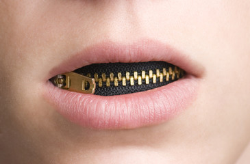 Zipper in Mouth of Youthful Person