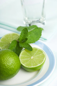 limes and mint on plate