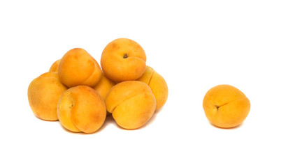 Pile o apricots isolated on white background