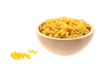 spiral pasta in a wood bowl