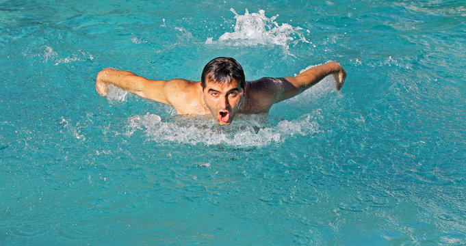 Swimmer in a pool training butterfly stroke
