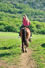 teenage girl on a horse