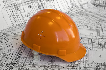 Orange helmet on the project drawings