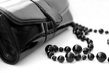 Black theatrical handbag and beads