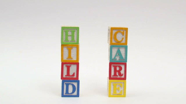 Wooden alphabet blocks spell out CHILD CARE