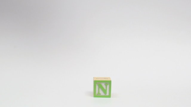 Wooden alphabet blocks spell out LEARN
