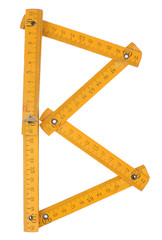 old yellow ruler forming font symbol B