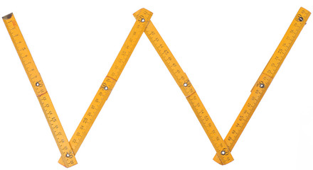 old yellow ruler forming font symbol W