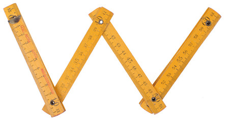 old yellow ruler forming font symbol  w
