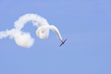 A plane performing in an air show