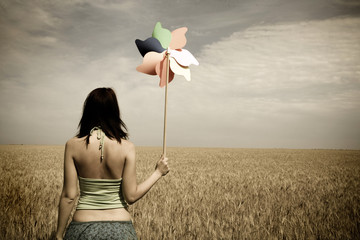 girl with toy wind turbine in retro style
