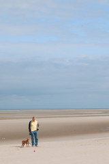 Empty beach with a man