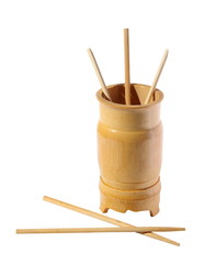 Wooden bamboo glass with the chopsticks on a white background
