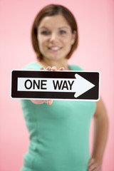 Woman Holding Road Traffic Sign