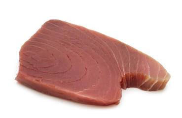 raw tuna steaks on white background
