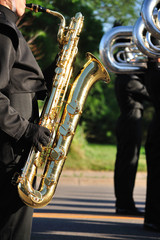 Marching Band Performer Playing Baritone saxophone in Parade