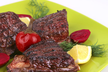 roast rib's on green dish