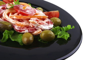 tomato with sour cream on black dish