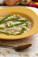 vegetable bouillon soup with asparagus and ham