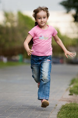 Fototapeta premium Little girl in outdoor settings