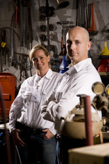Two co-workers in office maintenance room