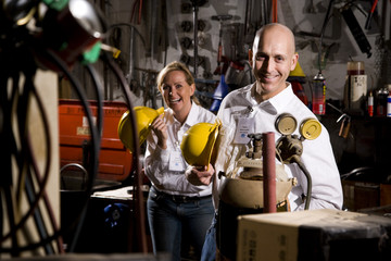 Two co-workers in office maintenance room