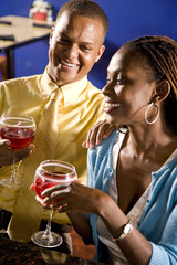 Close up of happy African couple drinking