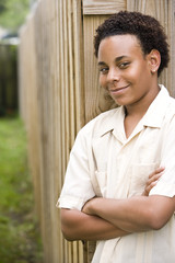Obraz premium African American teenage boy with arms folded