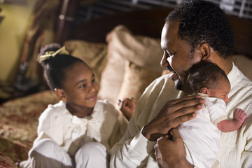 African American father with his beautiful children