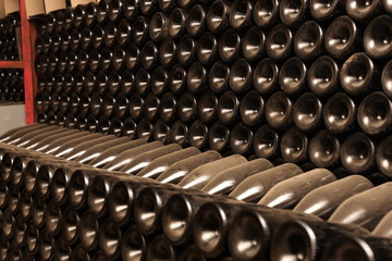 Fototapeta na wymiar Bottles in wine cellar