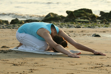 Yoga exercise on the beach